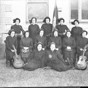 Group of 13 Salvation Army women with their musical ins...
