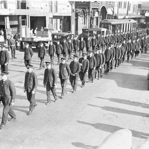 Uniformed tramwaymen leading the procession