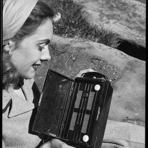 File 113: Portable AWA radio with model Judy Priestly at Mrs Macquarie's Point, ca. 1947 / photographed by Max Dupain