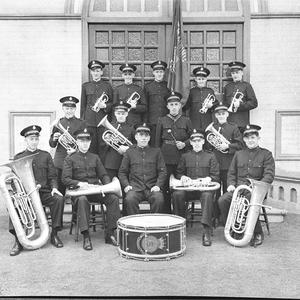 Fourteen male Savation Army officers with their musical...
