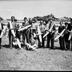 Nine young model aeroplane club members with their mode...
