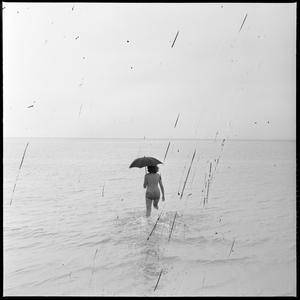 File 28: Girl in bathing with umbrella, December 1963 /...