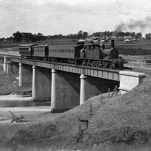 Rail and road bridges at Camden, with steam train on br...