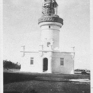 Lighthouse keepers lifting brass top onto light - Pt Pe...