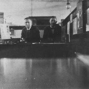 Bank manager and teller at counter - Bega, NSW