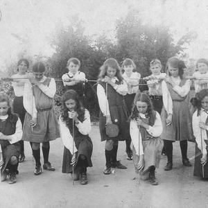 Schoolgirls exercising with sticks - Deniliquin, NSW