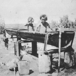 Girls washing in horse trough at Boonoke outstation - B...