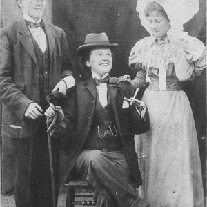 Studio portrait of three women, two dressed as men - Sy...