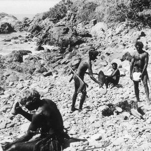 Aboriginal men selecting stones for axes and implements...