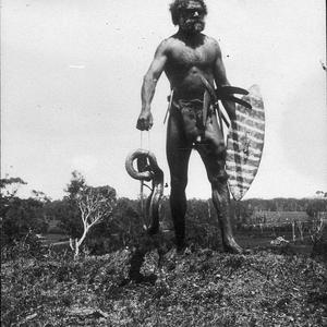 Aborigine with dead snake - Port Macquarie area, NSW