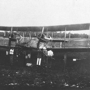 Front view of Vickers Vimy with crew and local official...