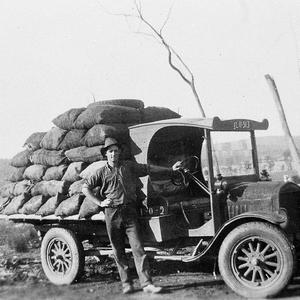 Roy Hawken carting the charcoal to the Parkes flour mil...