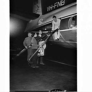 Skiers boarding an Airlines of NSW Fokker Friendship Ro...