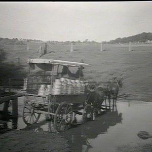 Milk cart crossing a stream