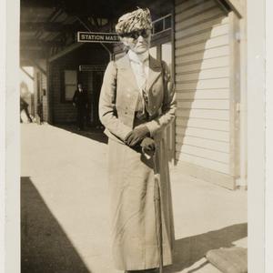 Daisy M. Bates, C.B.E., on a railway station platform, ...