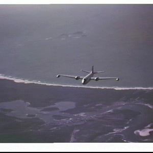 RAAF Canberra jet bomber flying over the coastline near...
