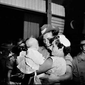 Army disembarks at East Circular Quay and greets family...
