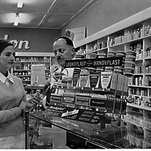 Chemist and assistant with Beiersdorf Handyplast displa...