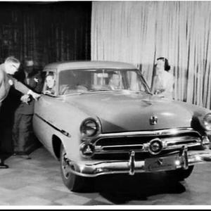 Ford advertising photograph of a Customline in a showro...