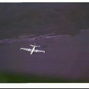 RAAF Canberra jet bomber flying over the coastline near...