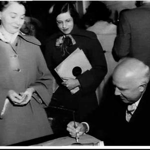 Pianist Walter Gieseking signs his records while on an ...
