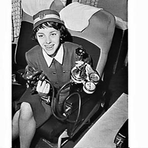 Airlines of NSW air hostess with respirator