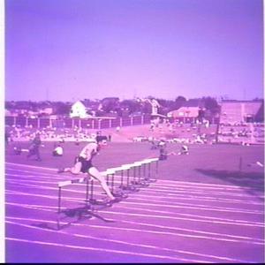 D. Lean running the 440 yards hurdles before winning in...