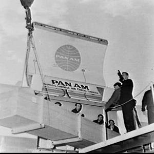 Unloading crates from Pan Am air cargo plane, Mascot