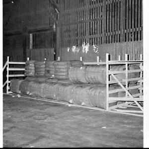 Wool bales in a pen on the wharf to be loaded onto the ...