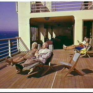 Passengers in deck chairs on the P&O liner Oriana at se...