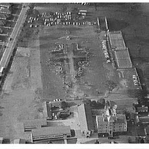 Aerial photographs of Holy Cross College with people making the shape of a large cross on the playing field, Ryde