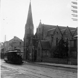 King-Ocean Street cable tram passing a Gothic Revival C...