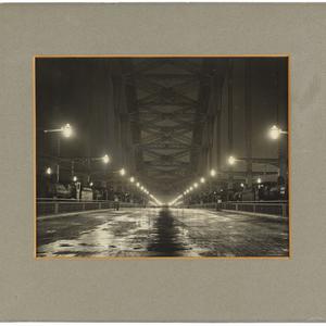 View of Sydney Harbour Bridge at night, showing steam l...