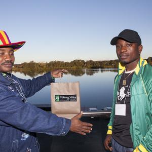 Item 059: Malike shows his gift bag received from the T...