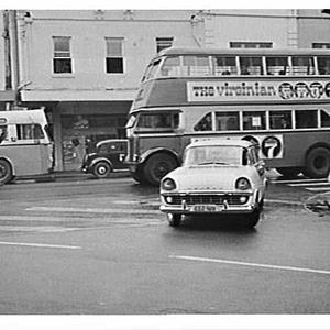 Buses with advertisements and pedestrians, King Street,...