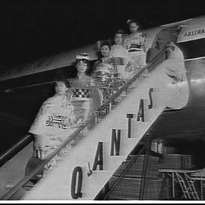 Japanese models in kimonos arrive on a Qantas airliner,...