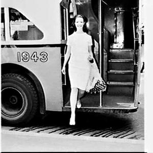 Woman steppingfrom a Governement bus, Sydney