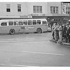 Buses with advertisements and pedestrians, King Street,...