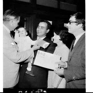 Presentation of Canadian Pacific air tickets to a famil...