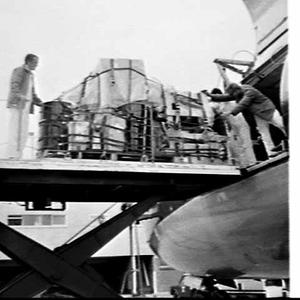 ICI ANZ drums being unloaded from a BOAC cargo flight, ...
