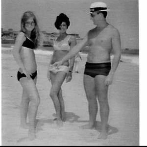 Beach inspector points out that the dark bikini contrav...