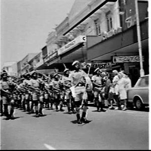 Papua New Guinea Army Pipe Band performs in the shoppin...