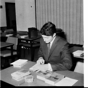 Trainee instructor for Reading Dynamics at a desk in th...