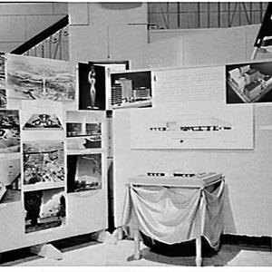 Lend lease display of photographs and a model of the ne...